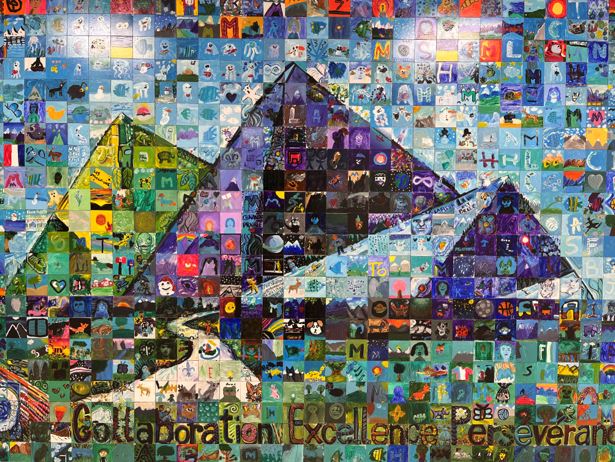 Mural created with over 600 tiles that were created by individual students depicting three mountains.